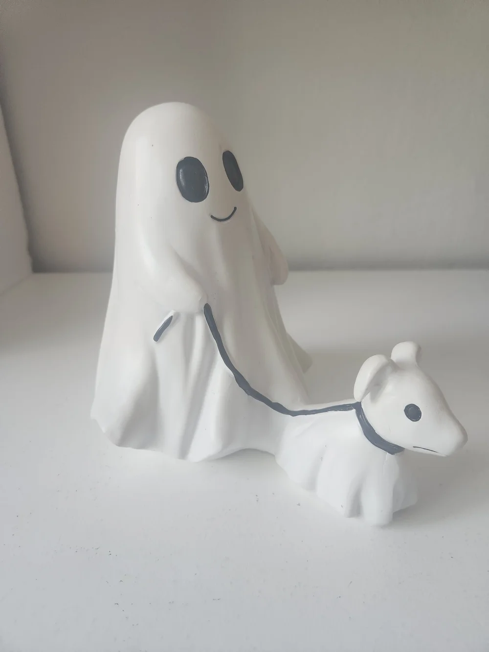 White Resin Ghost Figurine Walking A Ghosr Dog